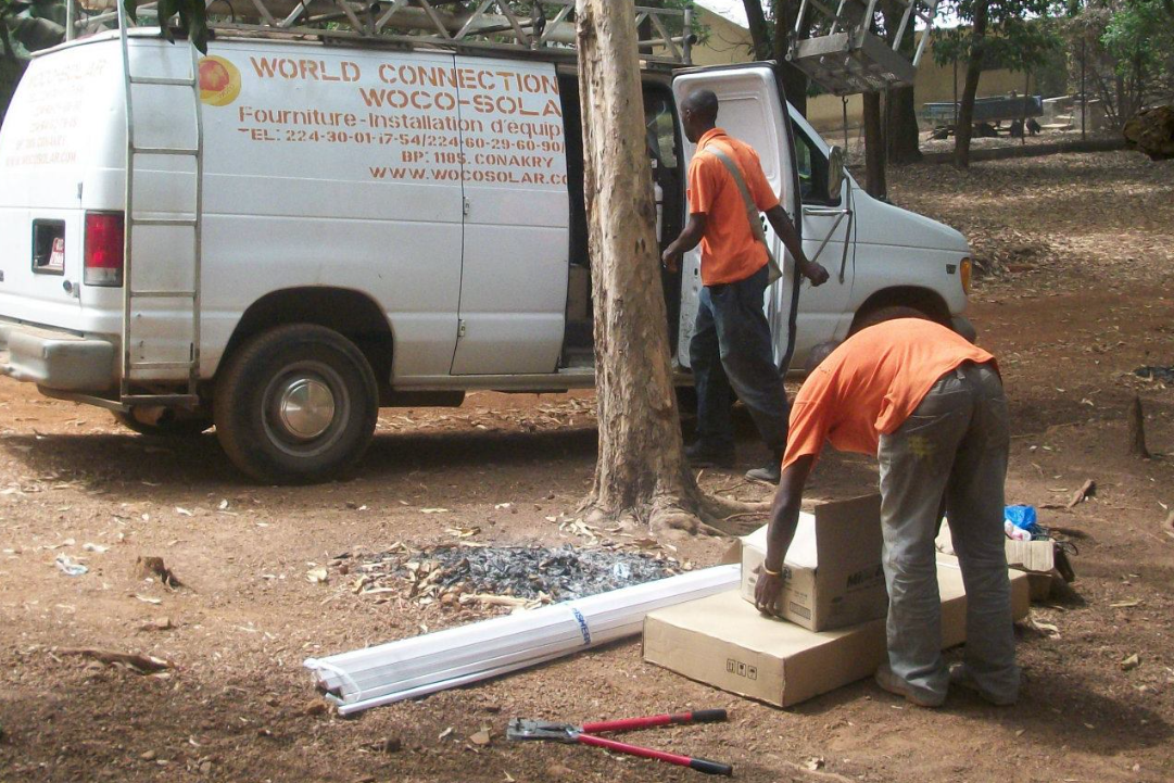 Woco Solar technicians preparing equipment and materials at project site