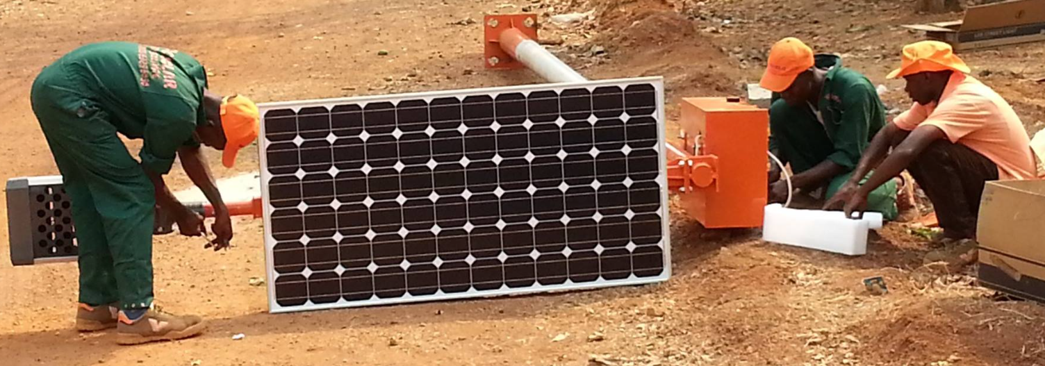 Woco Solar technicians working with solar panels and equipment at I.S.M.G Boké installation - 2013